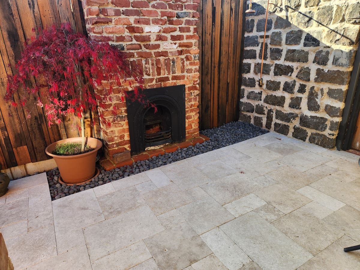 Courtyard paving and fireplace